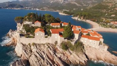 Rocky coast of the island of Sveti Stefan. Drone. High quality 4k footage