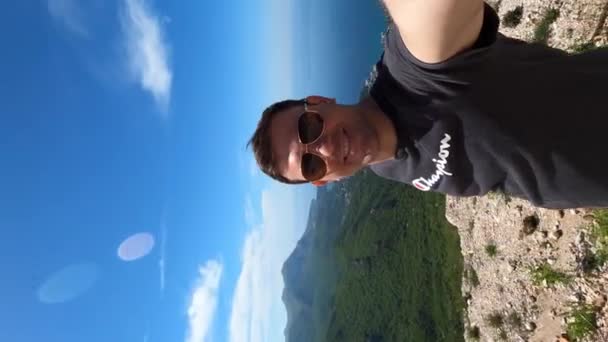 Young Man Sunglasses Stands Mountain Backdrop Panorama Bay Kotor High — Stockvideo