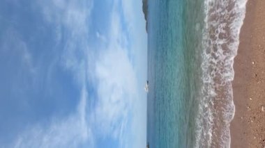 White yacht sails on the sea along the horizon. High quality 4k footage