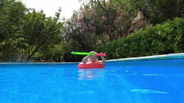 Little Girl Swims Inflatable Ring Pool Bright Toy Her Hands — Stockvideo