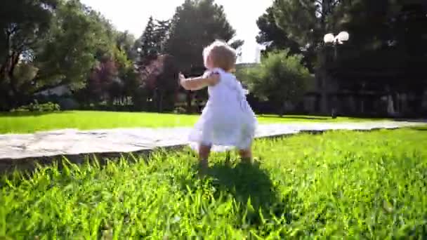 Little Girl Runs Paved Path Garden Green Grass High Quality — Stockvideo