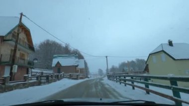 Road in a snowy town. Zabljak, Montenegro. High quality 4k footage