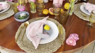 Name plate next to the napkin lies on a plate on a set table. High quality 4k footage