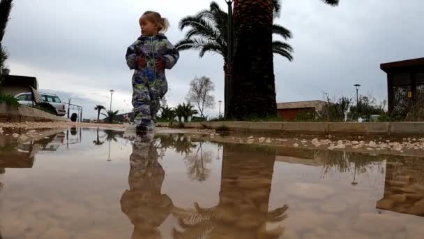 Little Girl Rubber Boots Walks Puddle Path Slow Motion High — Wideo stockowe