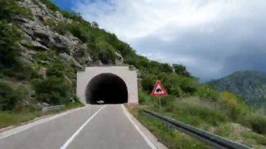 Travel by car through mountain tunnels on the highway. Time lapse. High quality 4k footage
