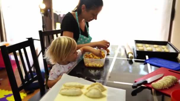 Little Girl Stirs Stuffing Spoon Next Her Mother Making Buns — Stok video