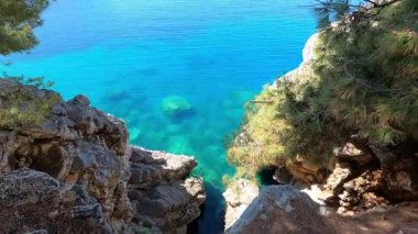 View from the cliff to the turquoise sea below. High quality 4k footage