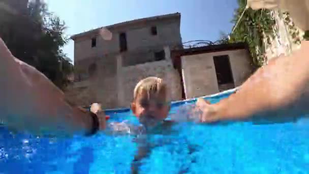 Dad Lifts Lowers Little Girl Pool Holding Her Hands High — Wideo stockowe