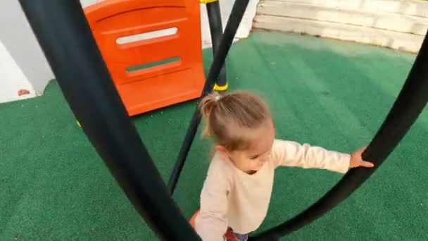 Dad Spins Little Girl Holding Handrails Vertical Carousel High Quality — Stock Video