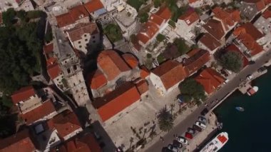 High tower of the church of St. Nicholas in Perast. Top view. High quality 4k footage