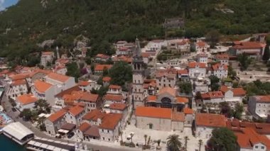 Old houses around the church of St. Nicholas on the seashore. Perast. High quality 4k footage