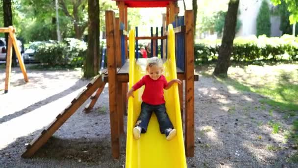 Little Girl Slides Slide Playground High Quality Footage — Vídeo de Stock