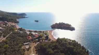 Island of Sveti Stefan is connected to the mainland by an isthmus. Drone. High quality 4k footage