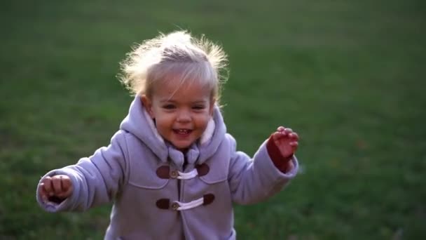 Little Smiling Girl Runs Green Lawn Falls High Quality Fullhd — Video Stock