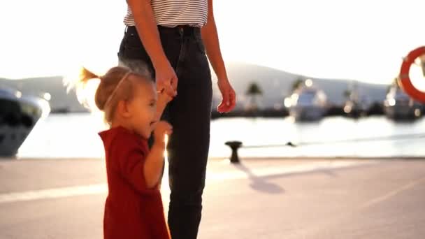 Little Girl Runs Her Mother Holding Her Hand Pier High — Stockvideo