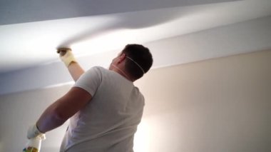 Cleaner sprays the walls and ceiling against mold. High quality 4k footage