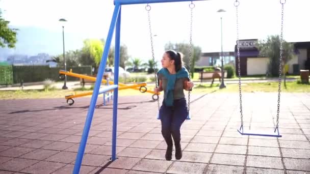 Young Woman Swinging Chain Swing Playground High Quality Footage — Vídeo de Stock