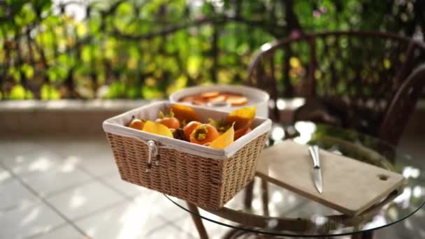 Wicker Box Ripe Persimmons Stands Table Balcony High Quality Footage — 비디오