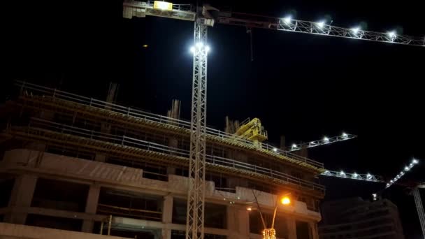 Illuminated Tower Crane High Rise Building Construction Site High Quality — Stock Video