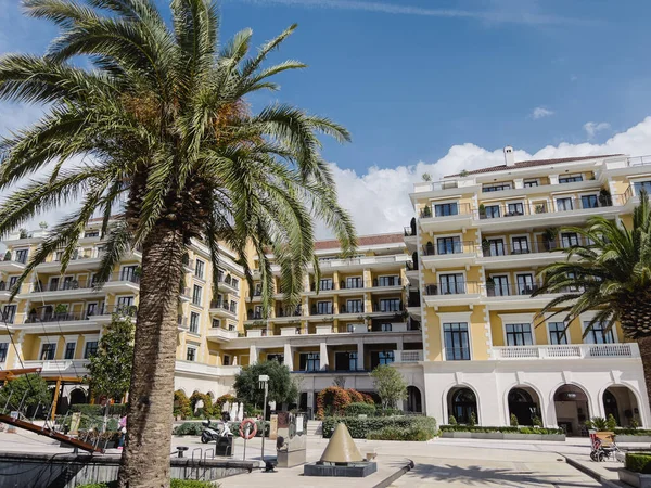 stock image Green trees and bushes in front of the Regent Hotel. Porto, Montenegro. High quality photo