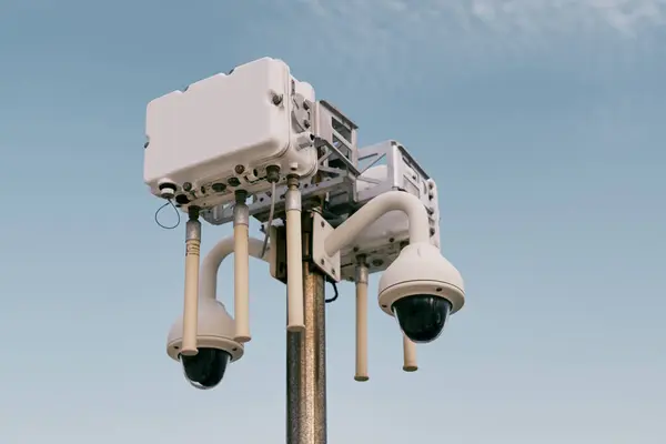 Street wi-fi router on a pole with video cameras against the sky. High quality photo