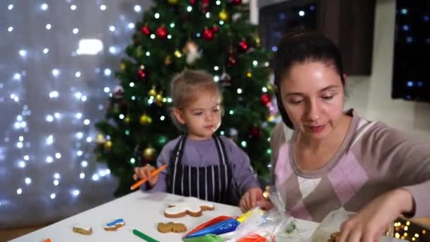 Mom Teaches Little Girl How Apply Icing Cookies Pastry Bag — Stock Video