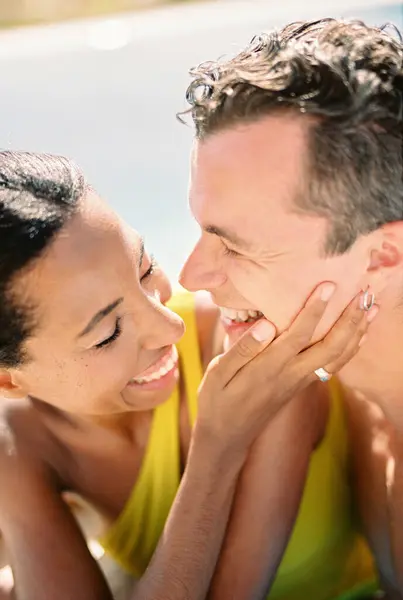Laughing Woman Touches Cheek Laughing Man While Standing Swimming Pool Stock Picture