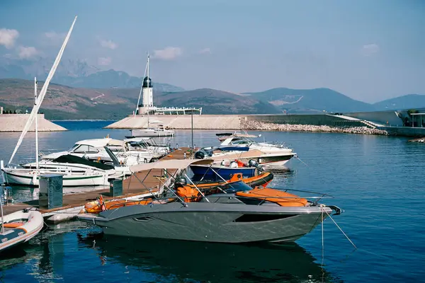 stock image Motor yachts are moored at the pier in Lustica Bay near the lighthouse. Montenegro. High quality photo