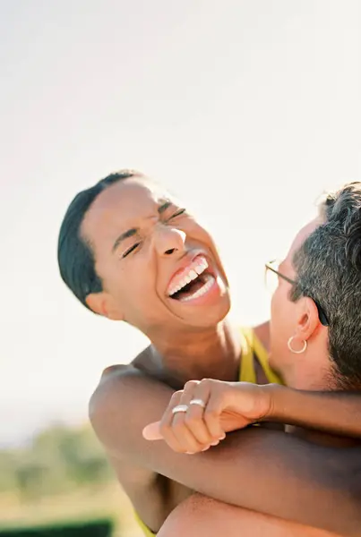 stock image Woman laughs, hugging man neck. Close-up. High quality photo