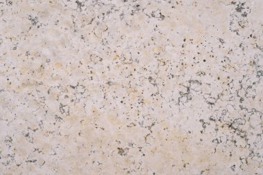 Üzerinde kahverengi lekeler ve gri çizikler olan taş bir arka plan. Yüksek kalite fotoğraf