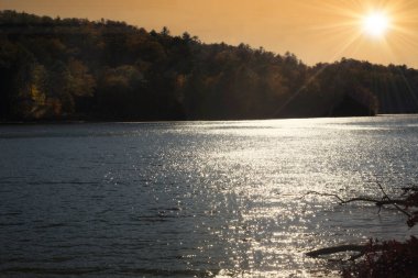 Sun setting over the horizon on a lake in North Carolina