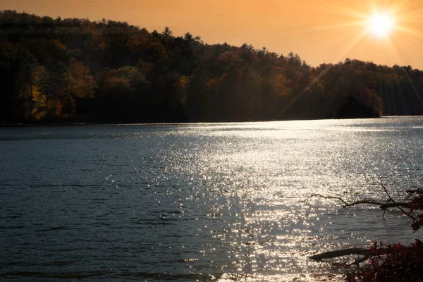 Sun setting over the horizon on a lake in North Carolina