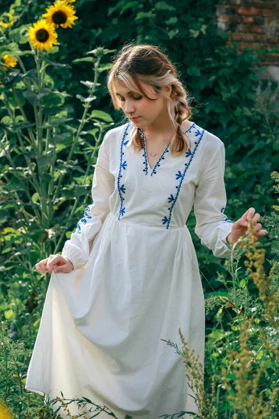 stock image Girl-Ukraine, Ukrainian woman in a field with a parasol