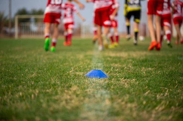 stock image A grassy soccer field where children run and practice soccer