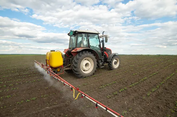 stock image Tractor spraying pesticides at soy bean fields