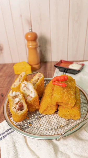 Selective focus risoles sosis mayo (American risoles) or mayonnaise sausage rissole is a small patty rolled in breadcrumbs. it is filled with mayonnaise, beef, cheese and onion. Serve on cooling rack