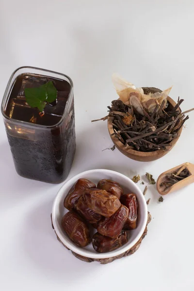 glass of ice ayurvedic herbal black tea or Liang tea. The Time of Tea Break. Liang teh Medan. drink of herbal tea Liang