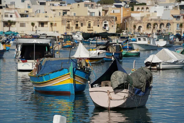 malta colorful painted fishing boat in marsaxlokk harbor