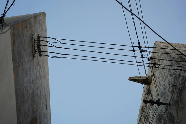 Malta electric wires hanging on building detail