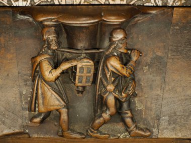 TOLEDO SPAIN - 16 Aralık 2022 İspanya 'nın Toledo Katedrali' nde oyulmuş maun koro koltukları ahşap heykel