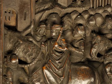 TOLEDO SPAIN - 16 Aralık 2022 İspanya 'nın Toledo Katedrali' nde oyulmuş maun koro koltukları ahşap heykel