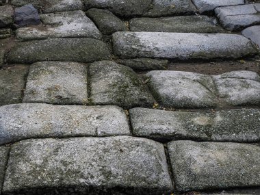 Roman stone path at Old Mosque of Bab al-Mardum or Hermitage of Cristo de la Luz. Historic city of Toledo. Spain. UNESCO World Heritage.