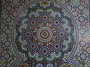 Craftsman painting and decorating ceramic products in pottery mosaic factory in Fez, Morocco, North Africa