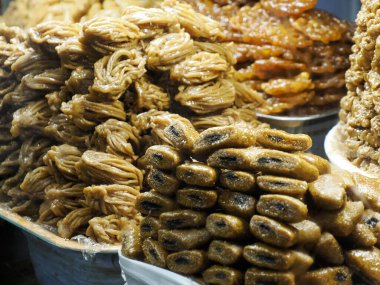 Moroccan biscuits and pastries dipped in honey for sale in the Medina of Fez in Morocco