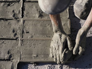 Craftsman painting and decorating ceramic products in pottery factory in Fez, Morocco, North Africa