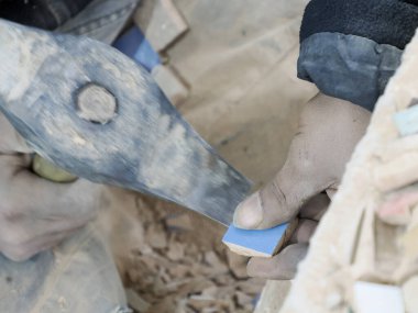 Craftsman painting and decorating ceramic products in pottery factory in Fez, Morocco, North Africa