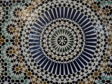 Craftsman painting and decorating ceramic products in pottery mosaic factory in Fez, Morocco, North Africa