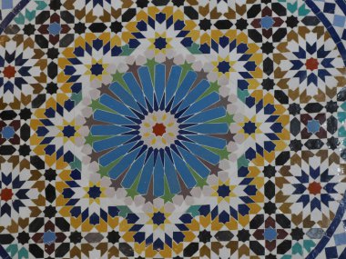Craftsman painting and decorating ceramic products in pottery mosaic factory in Fez, Morocco, North Africa