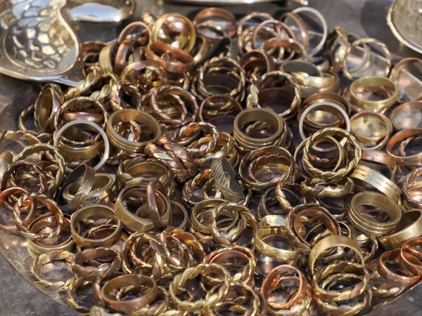 Copper ware shop with crockery, pots and pans in the metal work part of Fes soukh, Morocco