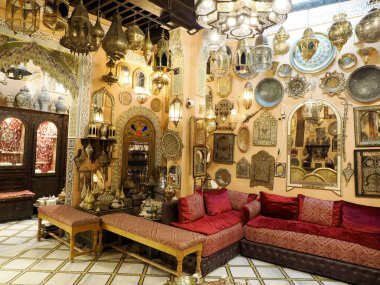 Metal craftsman making copper trays in Fes Morocco
